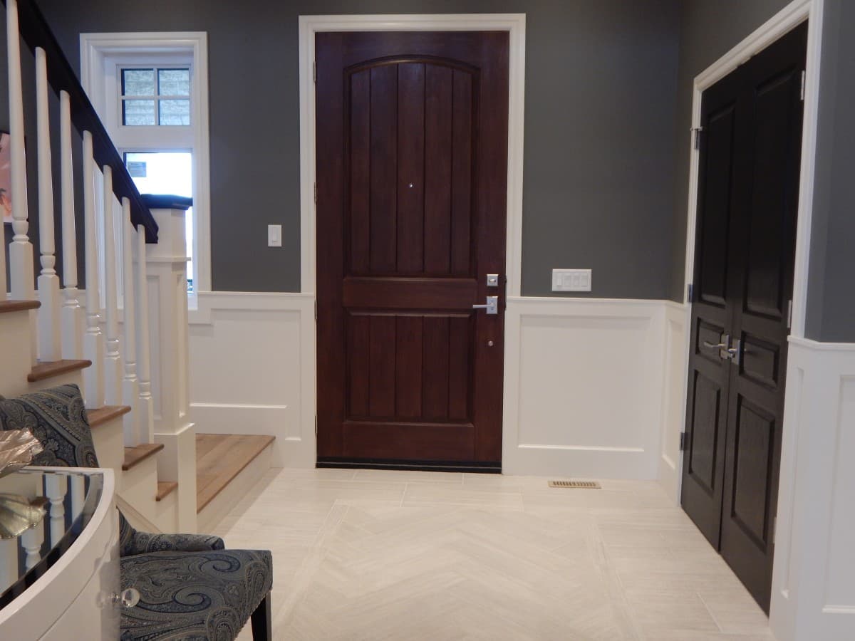 Hallway walls, wainscotting, and bannister painted with Benjamin Moore Jet Black, Witching Hour, and Chantilly Lace. Shaughnessy, Vancouver.