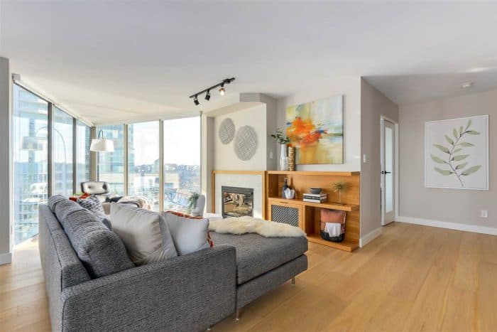 Condo at 1000 Beach Avenue — corrected ceiling with dead flat paint, three thick coats in one direction. Complete repaint including dark metal windows painted white.